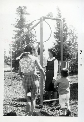 Children playing on rings in a playground