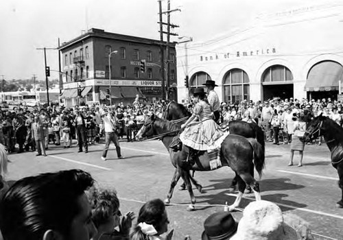 Horses turning corner of Main and Sunset in Blessing of the Animals procession