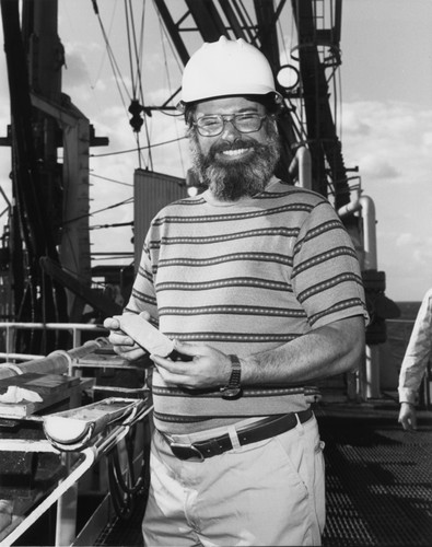 Deep Sea Drilling Project, Leg 76, Co-Chief Scientist Robert Sheridan holds a sample from one of the deeper cores retrieved during the recently concluded cruise. December 1980