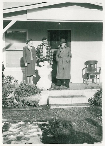 People on Front Porch with Snowman