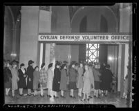 Women lined up at Civilian Defense Volunteer Office at Los Angeles City Hall following 1941 attack on Pearl Harbor