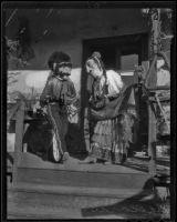 A man and woman dressed as Mascaras, Olvera Street, Los Angeles, 1936