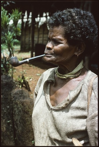 Woman with long pipe