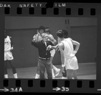 UCLA basketball coach John Wooden drilling players during practice in Los Angeles, Calif., 1973