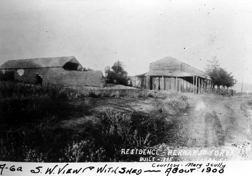 S. W. view of the Bernardo Yorba adobe with shed, on Rancho Santiago de Santa Ana about 1910