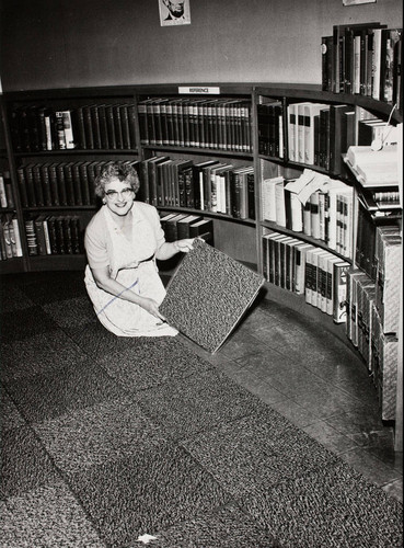 Banning Public Library Librarian, Dolores Smithpeter, during carpet installation in library