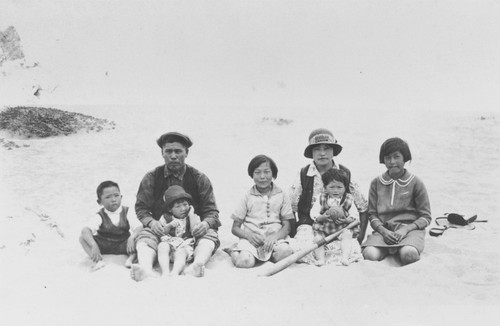 Takasugi Family at Oxnard Beach : about 1929. L-R: Nao, Mr. Shingoro Takasugi (holding Shika), Hisaye, Mrs. Takasugi (holding Midori) and Kaneko