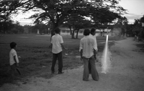 Boys playing with fireworks, La Chamba, Colombia, 1975