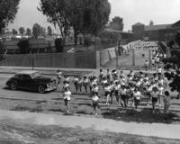 1940s - Teenage Girls in P.E. Uniforms Cross the Street