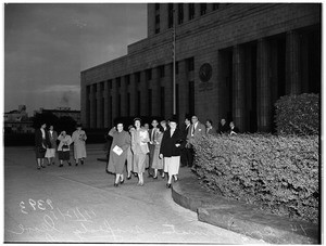 Communists... Fourteen communist suspects leave federal building for County Jail, 1951