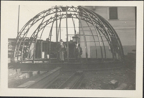 Three Men and Metal Dome Frame