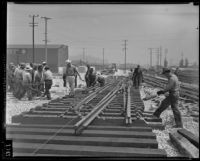 Workers lay tracks at new Union Station terminal, Los Angeles, 1938