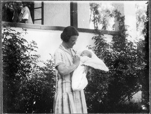Mrs. Ittameier with a baby, Arusha, Tanzania, ca. 1928-1930