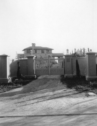 Front gates of Wilson residence, with view of house behind them