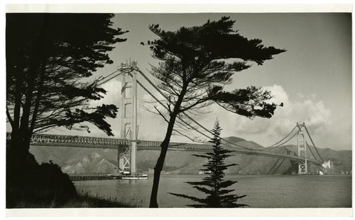 Golden Gate Bridge construction, view from east of Fort Point during paving of roadway