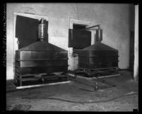 Two large liquor stills side by side, Los Angeles, Calif., circa 1920