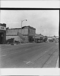 Tearing down buildings on North Petaluma Boulevard, across from Hill Park, Petaluma, California, 1959