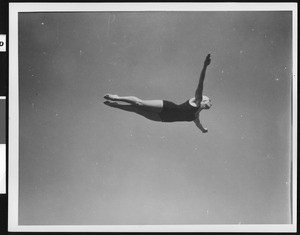 Female diver in mid-air, ca.1930