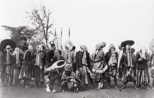 Foreign dancers with masks in Foumban, in Cameroon