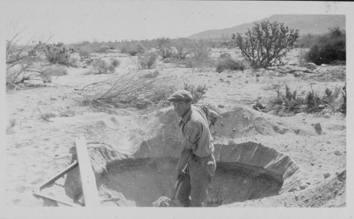 Series of 3 shots copied from a photo album page of men digging in rocky desert soil to place a power pole