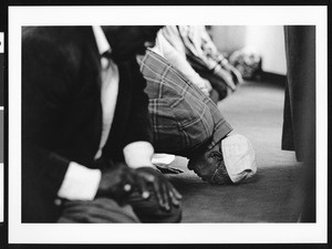 Man with head on floor in prayer, Los Angeles, 1999