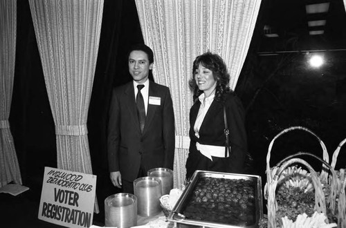 Paul C. Hudson posing at a buffet table during a Broadway Federal Savings and Loan event, Los Angeles, 1984