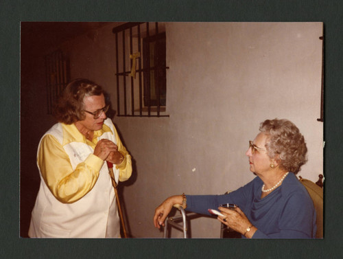 Mitzie James and Dorothy Drake conversing at Denison Library's 50th birthday celebration, Scripps College