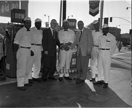 Handshake with gas station attendants, Los Angeles, ca. 1958