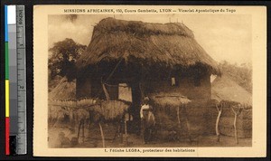 Man outside a thatched house, Lome, Togo, ca. 1920-1940