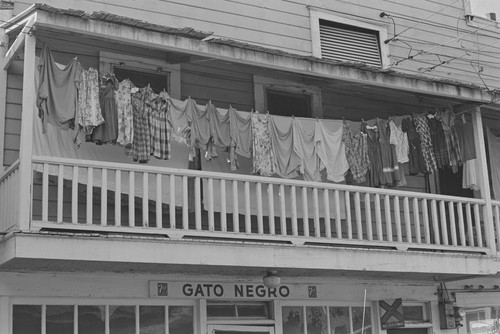GATO NEGRO storefront and hanging laundry, from Walnut Grove: Portrait of a Town