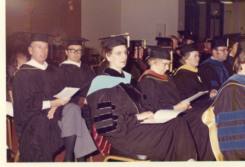 Faculty seated--Row #1: Louise Thomas, Unknown, Mrs. Dorothy Moore, Dr. James Hedstrom, ; Row #2: Tom Nelson, James Atkinson