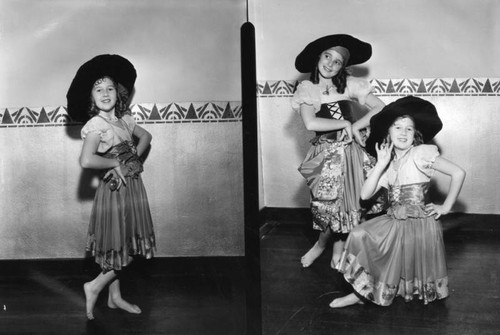 Three women in dance costumes