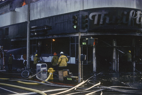 Firefighters battling a blaze at Thrifty Drug Store at 326 Wilshire Blvd