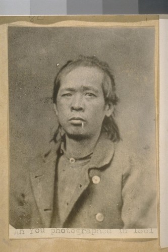 Ah You photographed in 1861. Ah You, Born in China, Age 23 years, weight 136, Height, 5 ft. 3 inches, complexion, copper coloured, Hair & eyes black, nose flat at the bridge, face full, number of small moles on right cheek, one mole on left side of neck, sent to Co. Jail, Nov. 22.61. for 90 days on charge of petit Larceny, arrested by Citizen John Nichols. [?] taken Nov. 22 [?]. This Chinaman was the first Chinese to be photographed in the Police Gallery when it was first opened in 1861 at San Francisco