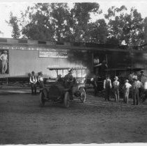 Photographs from Wild Legacy Book. Photograph, "Men and cars gathered around California Fish and Game Commission railcar, ca 1920