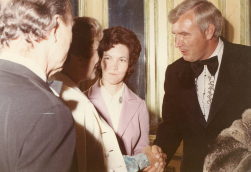 Dr. and Mrs. Jerry Hudson greeting Jane Wyman and her husband