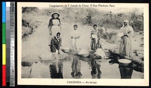 Women washing clothes at the edge of the water, Caconda, Angola, ca.1920-1940