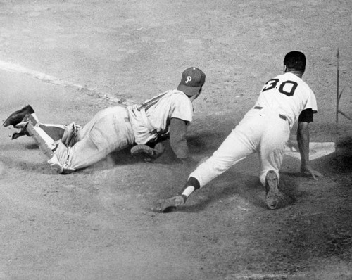 Phillies' Clay Dalrymple blocks Dodgers' Maury Wills at home in yesterday's action