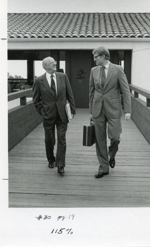 Dr. Howard White with Chairman of the Board of Regents, Tom Bost, on the bridge to the Brock House--Pose 1