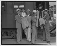 Actors arriving at station