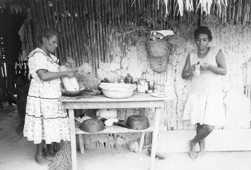 Woman grating a coconut, San Basilio de Palenque, 1976