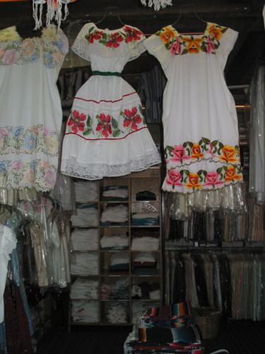 Traditional Mexican dresses hanging in a shop at El Faisan on Fourth Street, August 2002