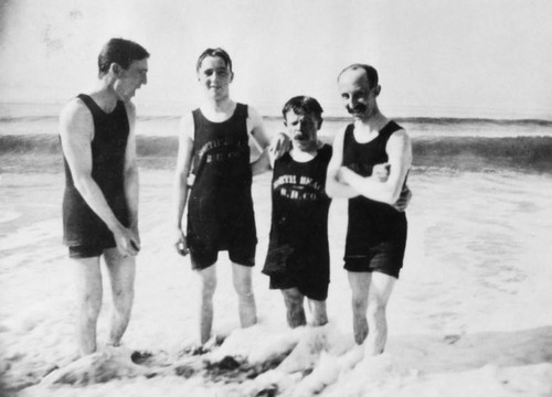 Four men in bathing suits