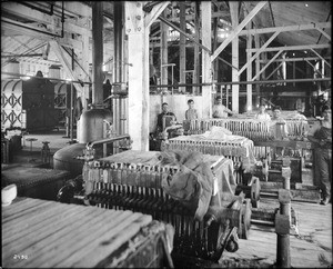 Interior of a beet sugar factory showing filter presses