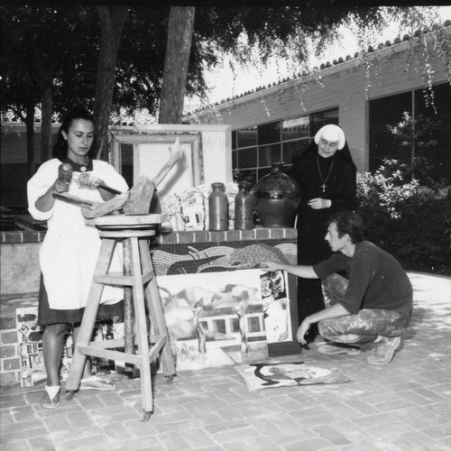 Two women and man with artwork, Scripps College