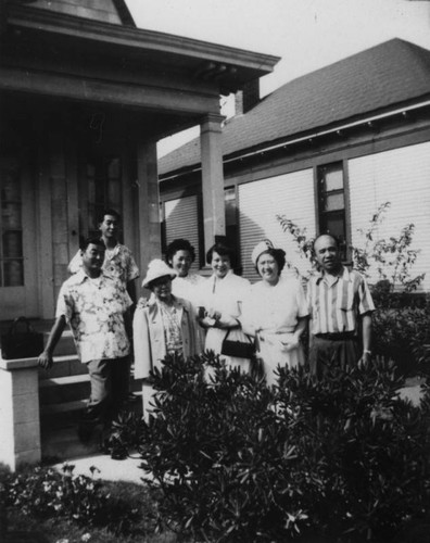 Korean American family in front of home