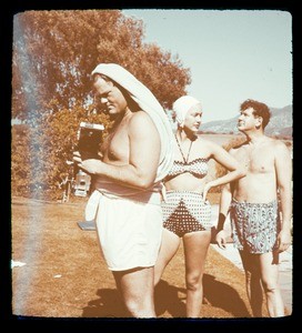 Milner family party, man with camera, ca. 1950s