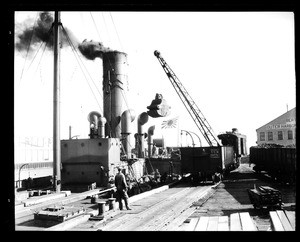 Men coaling on the deck of the H.I.M.S. Sapa, a Japanese tanker at Los Angeles Harbor, October 15, 1928
