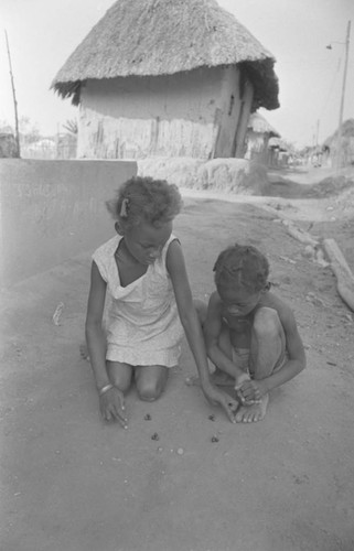 Children playing with marbles, San Basilio de Palenque, 1977