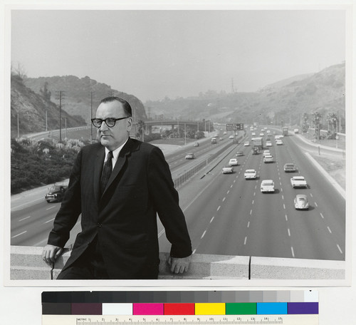 Governor Edmund G. Brown standing in front of a freeway